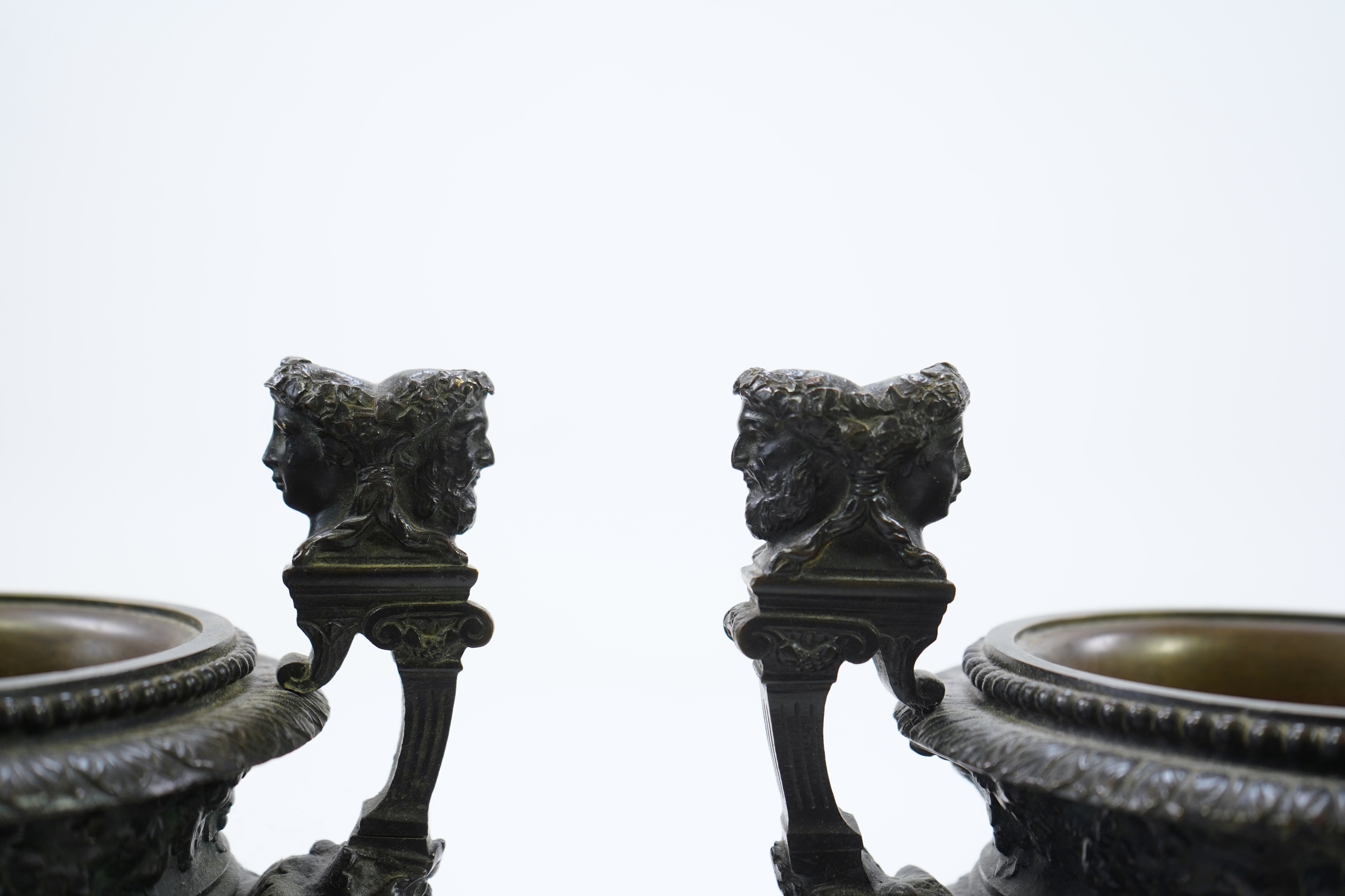 A pair of neoclassical revival bronze urns, late 19th century